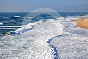Sandy beach, panorama. Panoramic view of the sandy beach. The sea wave rolls on the shore