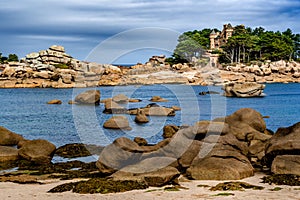 Sandy Beach And Pink Granit Boulders At The Atlantic Coast Of Ploumanach In Brittany, France