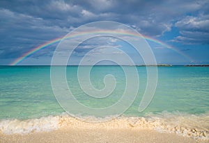 Sandy beach and rainbow