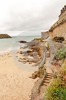 Sandy beach by Saint-Malo city walls