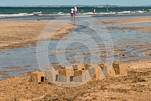 Sandy beach with sandcastles