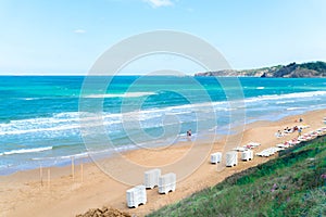 Sandy beach and sea against blue sky in Kilyos, cliffs at the far end, Black Sea Region in Ä°stanbul