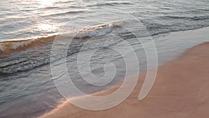 Sandy beach with sea waves