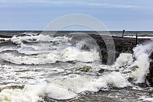 Sandy beach on stormy day by the sea