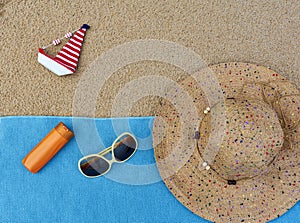 sandy beach with summer accessories travel blog content