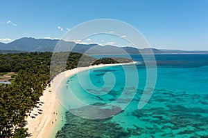 Sandy beach and turquoise water.