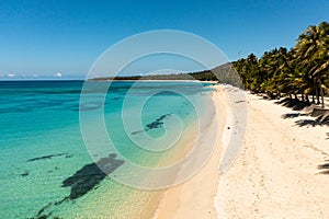 Sandy beach and turquoise water.