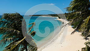 Sandy beach and turquoise water.