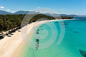 Sandy beach and turquoise water.