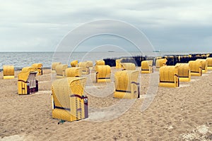 Sandy beach and typical hooded beach chairs in Cuxhaven in the North Sea coast