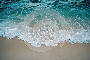 A sandy beach with waves continuously flowing in and out of the water, creating a mesmerizing sight, A serene view of ocean waves