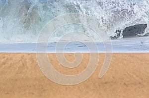 Sandy beach with waves in the distance