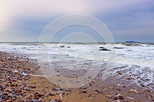 Sandy beach and white foam