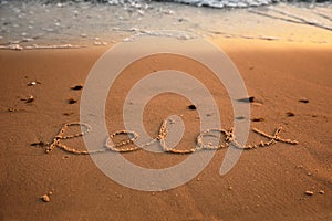 Sandy beach with written word Relax in summer