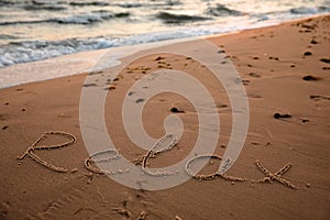 Sandy beach with written word Relax in summer