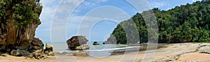 Sandy beach (Telok Paku) with rocks in Bako National Park, Borneo, Sarawak, Malaysia photo