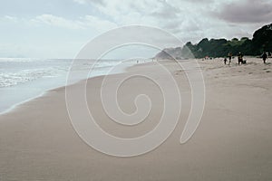 Sandy beachfront at Pikowai with patterns left in sand as water recedes