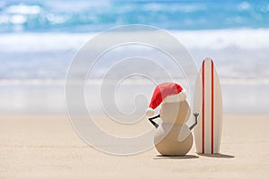 Sandy Christmas Snowman is watching the waves