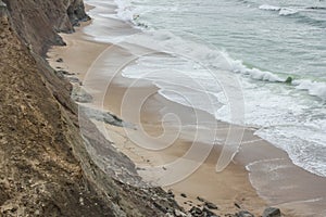 Sandy cove on Almagreira beach in the central Portuguese Western coast, in Peniche