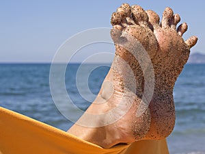 Sandy crazy woman toes on the beach photo