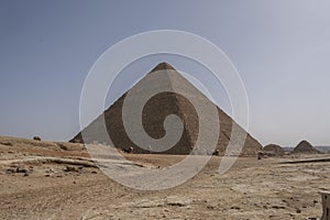 Sandy desert with Giza pyramids in the background