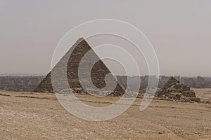 Sandy desert with Giza pyramids in the background