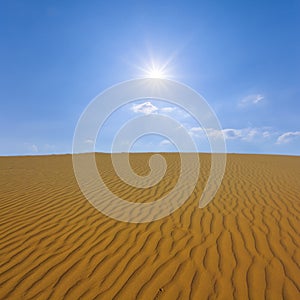 sandy desert under a sparkle sun