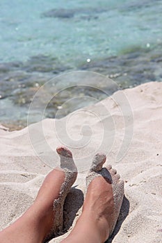 Sandy feet on the beach