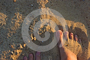 Sandy feet on the beach