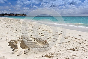 Sandy figure on Aruba beach