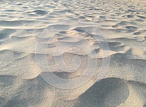 Sandy floor background. texture of gray sand on the beach