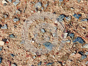 Sandy ground with dug pebbles