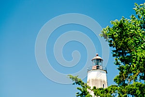 Sandy Hook Lighthouse New Jersey on clear sunny day