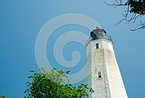 Sandy Hook Lighthouse New Jersey on clear sunny day