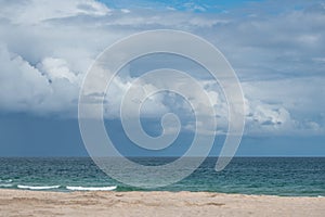 Sandy Miami Beach Florida with cloudy skies photo