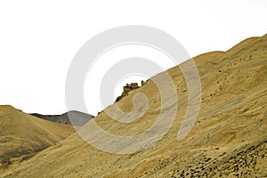 A sandy mountain hills with rocks