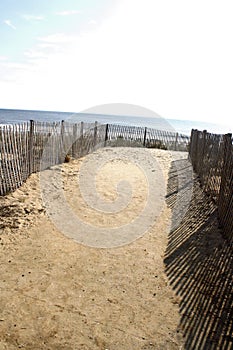 A sandy path leading to the beach in Rehoboth Beach, Delaware