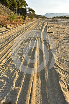 Sandy road to an ocean beach on coast of Baja California Sur, Mexico