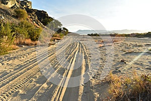 Sandy road to an ocean beach on coast of Baja California Sur, Mexico