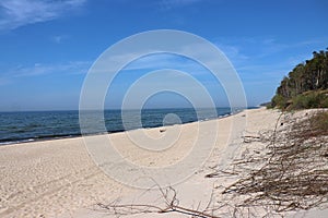 sandy sea beach on the Baltic Sea on a sunny day, DziwnÃ³w, Poland