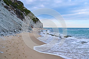 Sandy seashore and white rock in the background. Byala Bulgaria