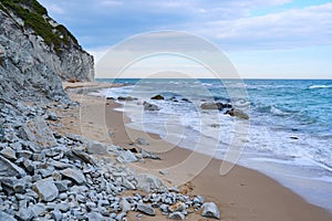 Sandy seashore and white rock in the background. Byala Bulgaria