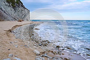 Sandy seashore and white rock in the background. Byala Bulgaria