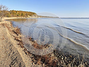 Sandy shore of Lake Khanka on a clear autumn morning. Russia, Primorsky Krai photo