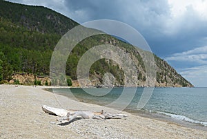 Sandy shore of the Sukhaya - Dry Cove before thunderstorm. Lake Baikal