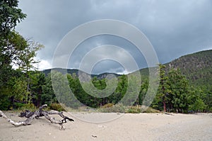 Sandy shore of the Sukhaya - Dry Cove before thunderstorm. Lake Baikal