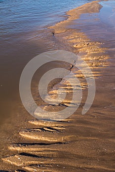 Sandy wave on a beach after a tide