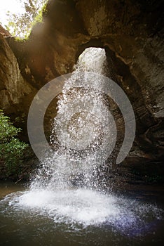 Sang Chan Waterfall is sometimes called Namtok Long Ru Waterfall Through a Hole .