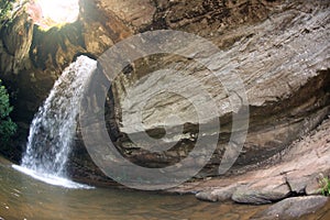 Sang Chan Waterfall is sometimes called Namtok Long Ru Waterfall Through a Hole .