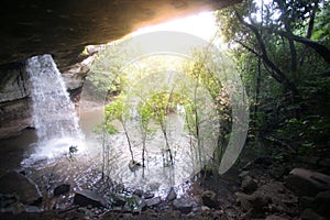 Sang Chan Waterfall is sometimes called Namtok Long Ru Waterfall Through a Hole .